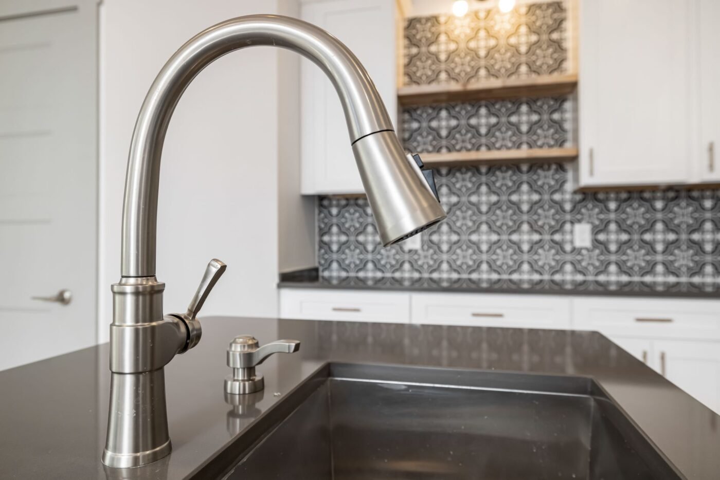 Modern kitchen faucet replacement by Quality Home Services in Tampa, FL