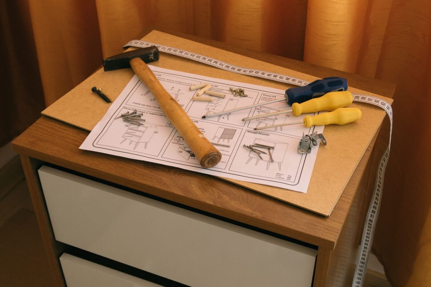 Flat-pack furniture assembly with tools and instructions